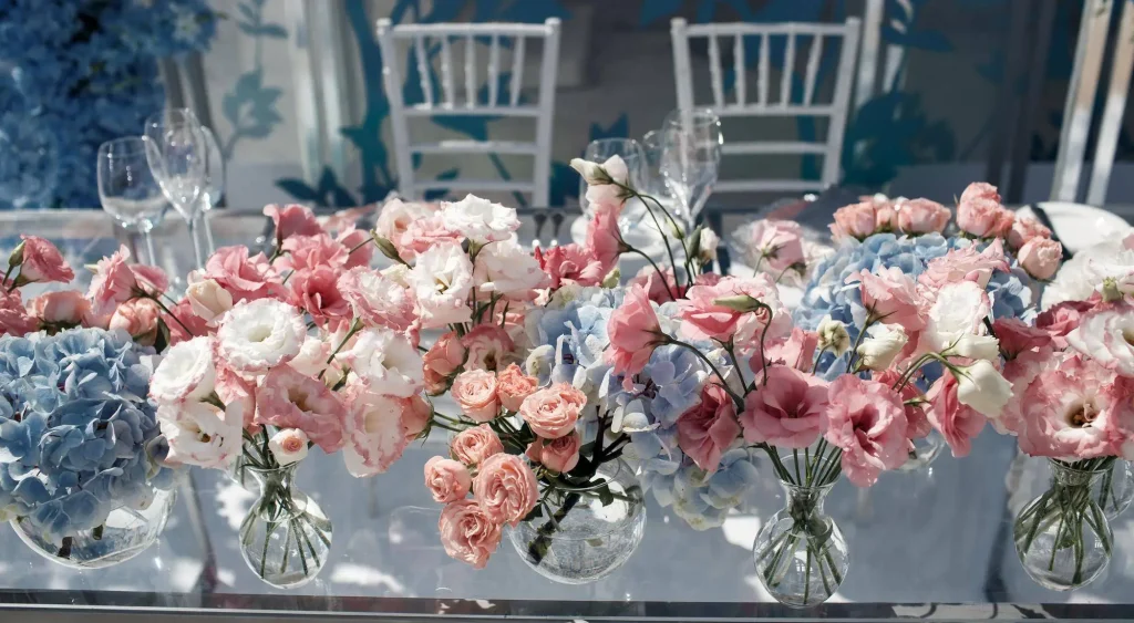 Woman's hand holding basket pf fresh flowers