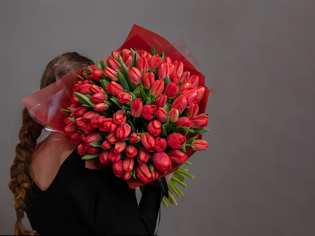 A bouquet of red tulip flowers in red sends a special message to the recipient